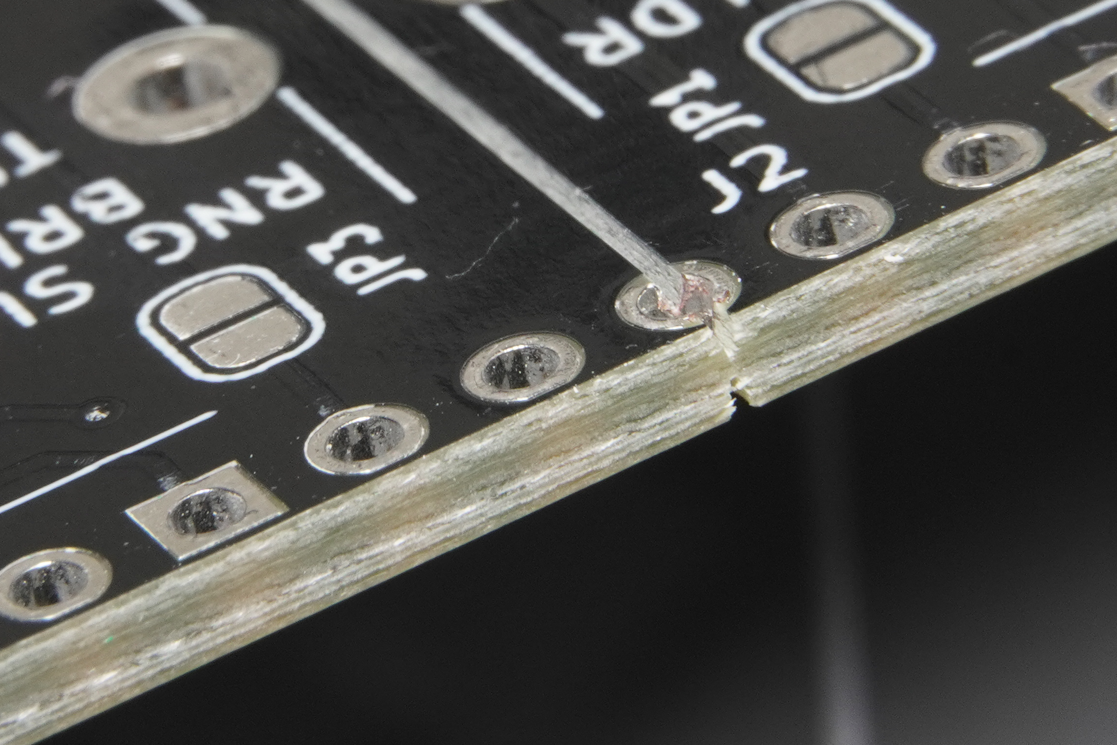 PCB layout showing component keepout zone near V-scoring line